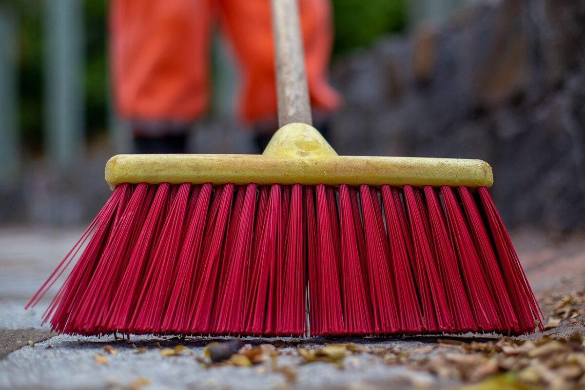 A wide floor squeegee on a concrete floor