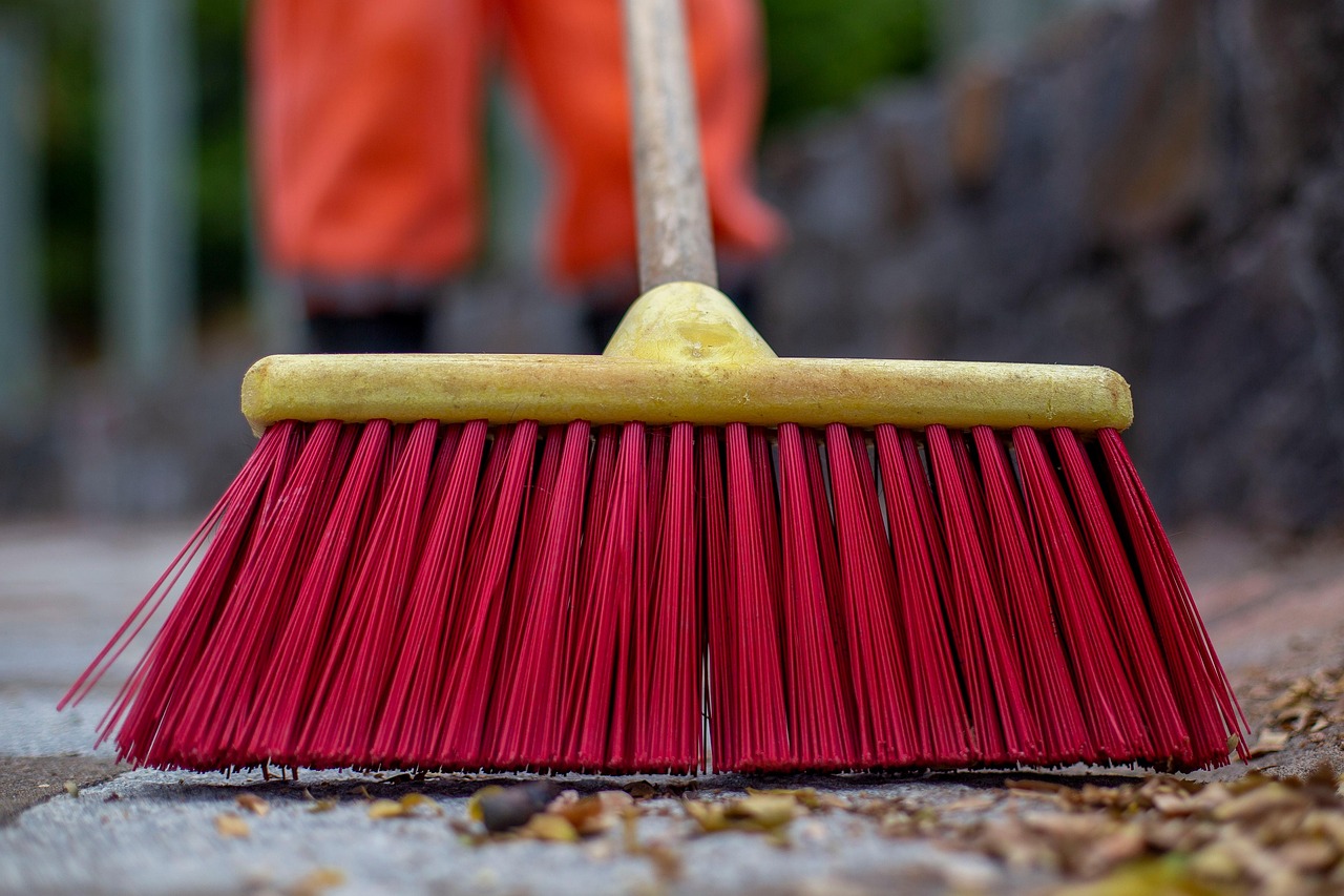 A wide floor squeegee on a concrete floor