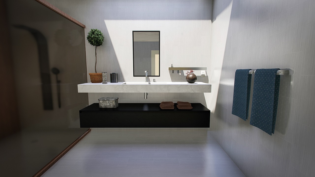 A shower squeegee hanging beside a glass shower door